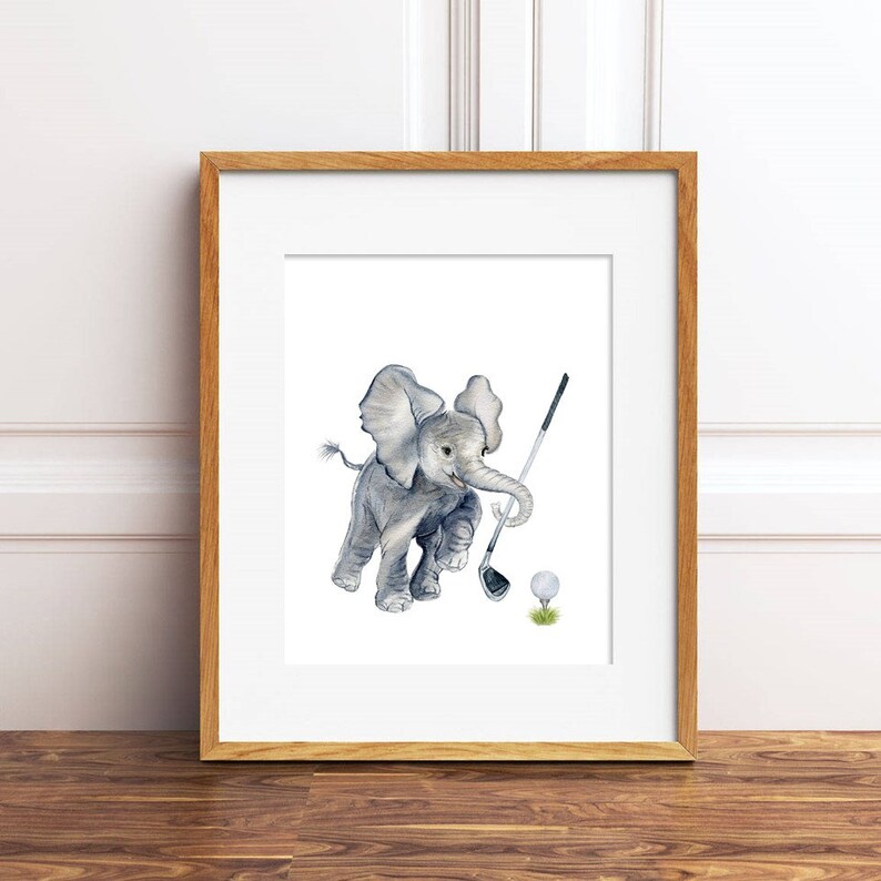 May include: A watercolor painting of a gray elephant swinging a golf club at a white golf ball. The elephant is in mid-swing, with its trunk extended and its legs in the air. The golf ball is on a patch of green grass.