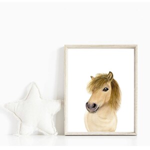 May include: A watercolor painting of a light brown horse with a light brown mane and tail. The horse is looking to the left of the image. The painting is framed in a light wood frame.