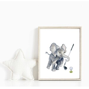 May include: A watercolor painting of a gray elephant playing golf. The elephant is holding a golf club and is about to hit a white golf ball. The background is white.