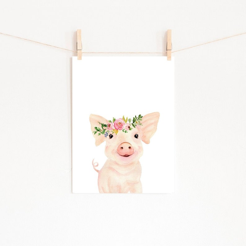 May include: A watercolour illustration of a pink pig wearing a flower crown. The pig is looking at the viewer with a happy expression. The background is white.