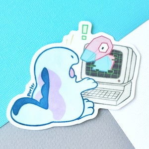 May include: A blue and purple cartoon creature with a surprised expression looks at a computer screen. The screen shows a pink and blue geometric shape. The computer is white with a black keyboard. The sticker is signed "Porter".