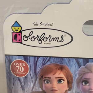 May include: A package of Colorforms featuring the characters Anna and Elsa from the Disney movie Frozen. The package has a blue and white background with a red circle that says "Over 70 Colorforms".