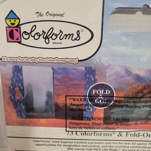 May include: A package of 73 Colorforms brand stickers and fold-out scenes. The package features a warning about the danger of suffocation from plastic bags. The Colorforms brand logo is visible on the package.