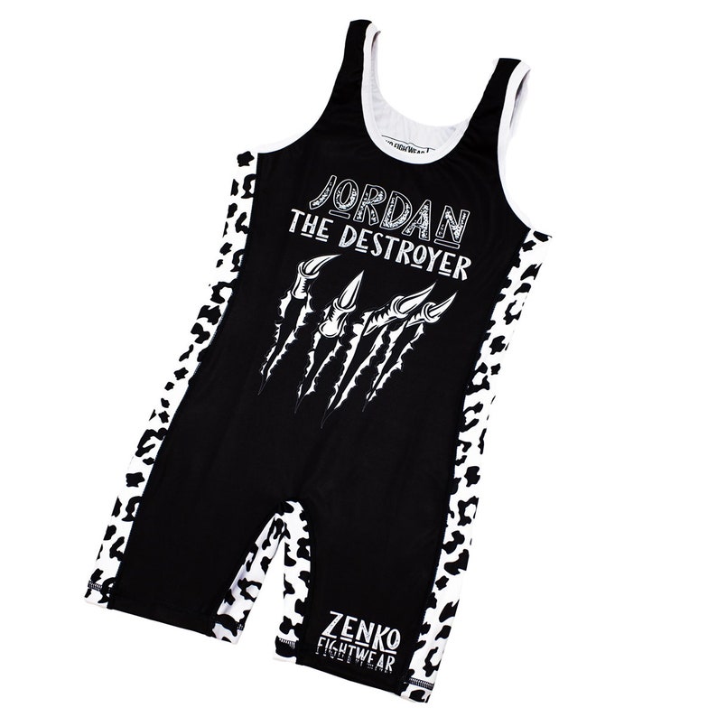 May include: Black wrestling singlet with white leopard print accents. The singlet features the text "JORDAN THE DESTROYER" and a graphic of claws. The text "ZENKO FIGHTWEAR" is printed on the bottom of the singlet.