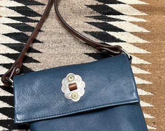 Small , blue leather, shoulder bag with vintage silver and sapphire slotted concho