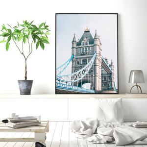 May include: A black and white photograph of Tower Bridge in London, England. The bridge is a famous landmark and is a popular tourist destination.