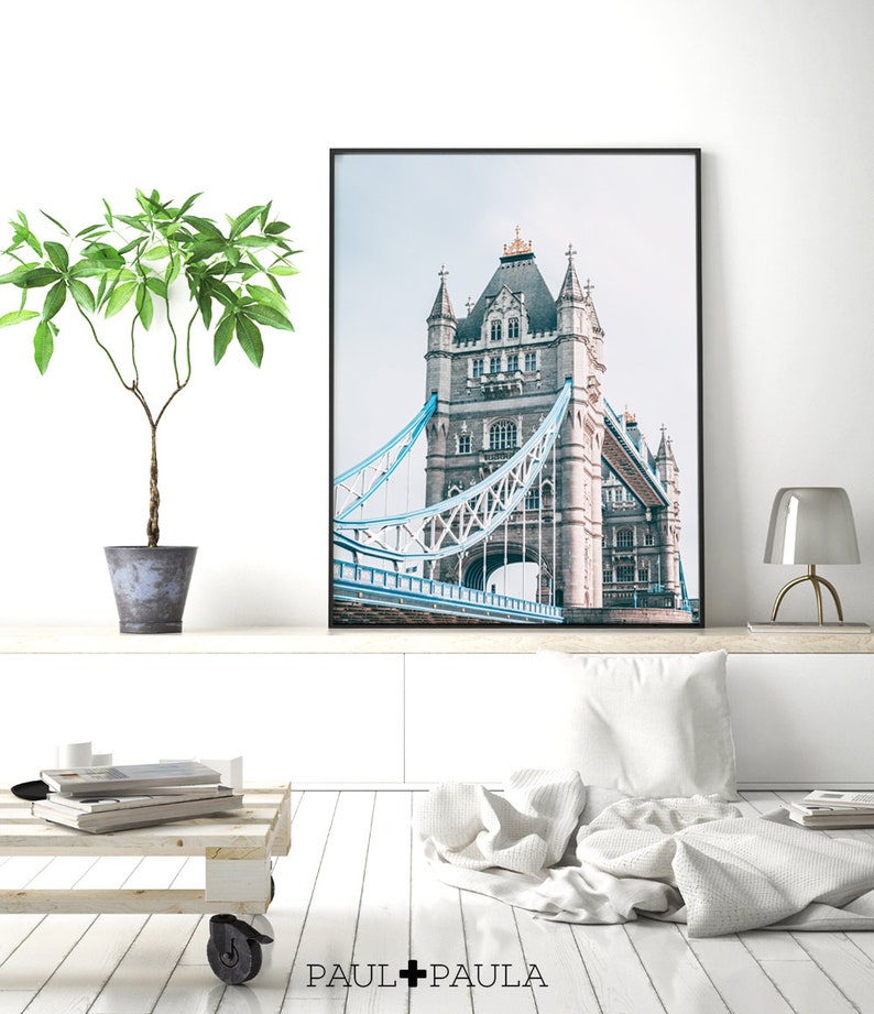 May include: A black and white photograph of Tower Bridge in London, England. The bridge is a famous landmark and is a popular tourist destination.