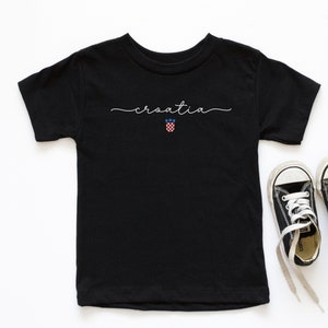 May include: Black t-shirt with the word "croatia" written in white script and a small Croatian flag graphic below.