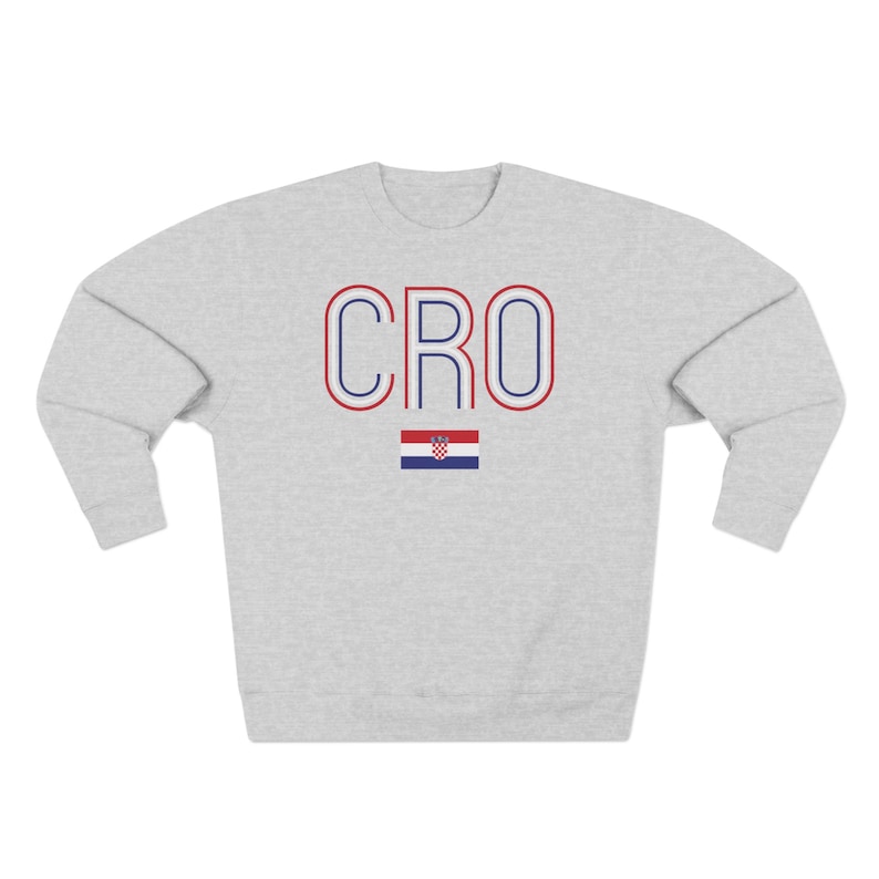 May include: A grey sweatshirt with the word "CRO" in blue and red letters with a white outline. The Croatian flag is below the letters.