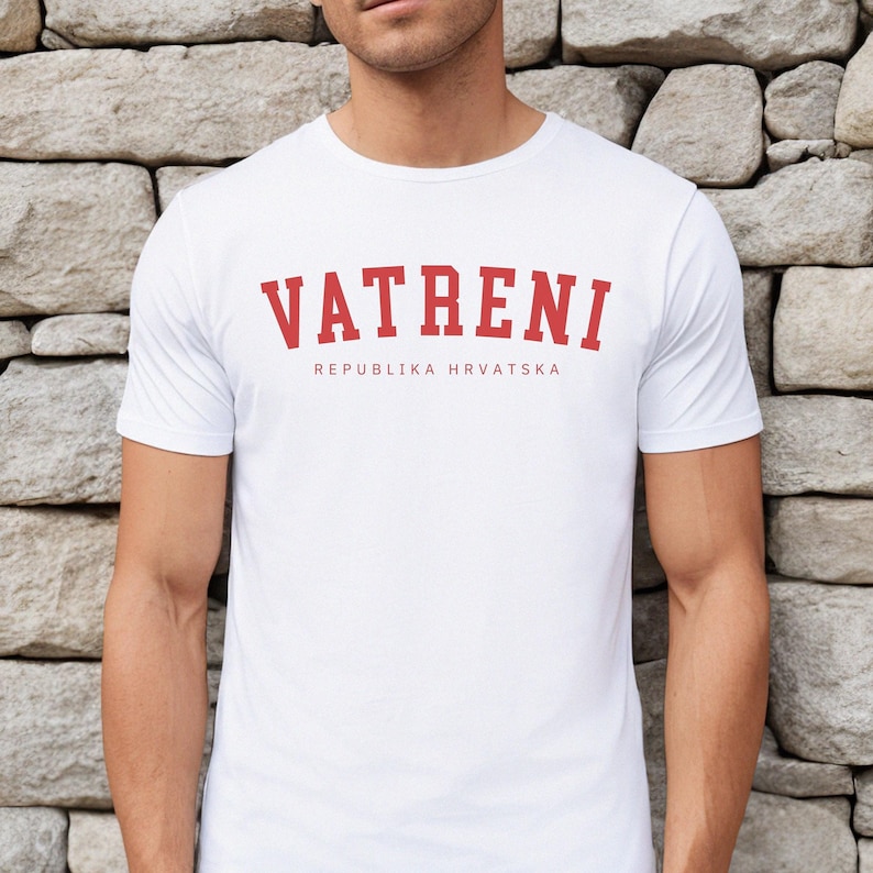 May include: White t-shirt with a red graphic print that says "VATRENI" and "REPUBLIKA HRVATSKA".
