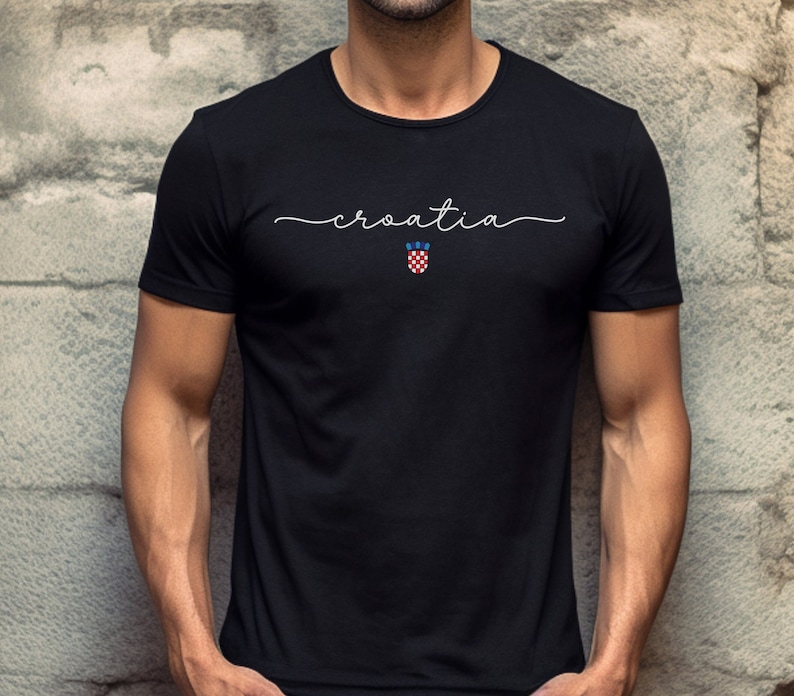 May include: Black t-shirt with white text that says "croatia" and a small Croatian coat of arms.