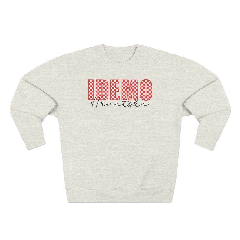 May include: A light gray sweatshirt with a red and white checkered design that says "IDEMO" and "Hrvatska" in black lettering.