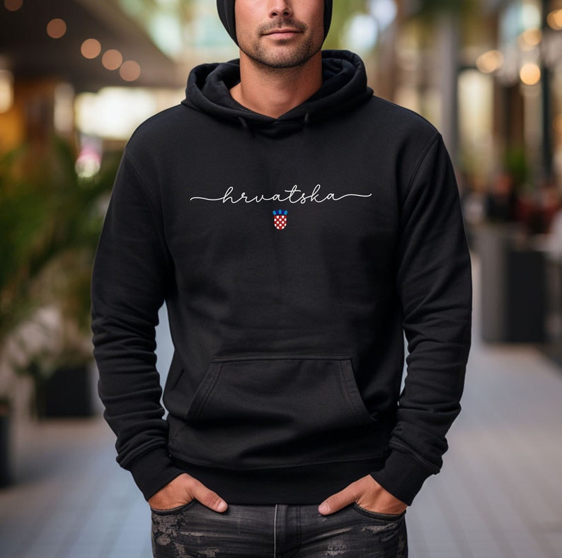 May include: Black hooded sweatshirt with the word "hrvatska" written in white cursive script and a red, white, and blue Croatian coat of arms.