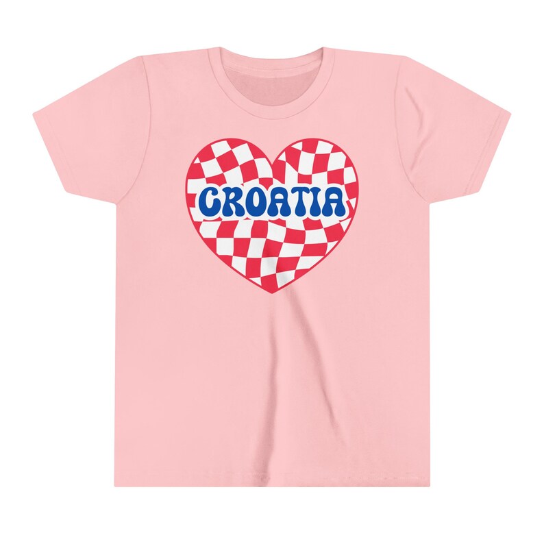 May include: Pink t-shirt with a red and white checkered heart design and the word "CROATIA" in blue letters.