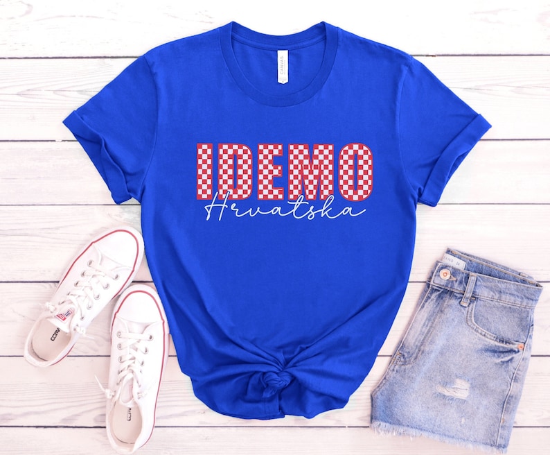 May include: A royal blue t-shirt with a red and white checkered design that says "IDEMO Hrvatska".