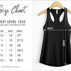 May include: Black racerback tank top hanging on a gold hanger. The image includes a size chart for the Next Level 1533 tank, with measurements in inches for width and length, ranging from XS to 2XL.