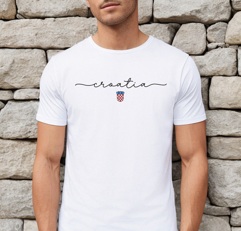 May include: White t-shirt with the word "croatia" written in cursive script and a small red and white checkered Croatian coat of arms below it.