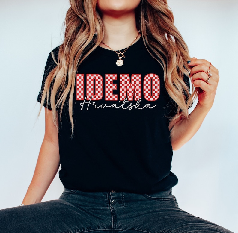May include: Black t-shirt with a red and white checkered "IDEMO" graphic and the text "Hrvatska" in white script.