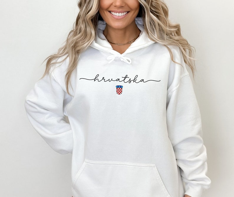 May include: White hooded sweatshirt with the word "hrvatska" in cursive script and a small Croatian coat of arms graphic.