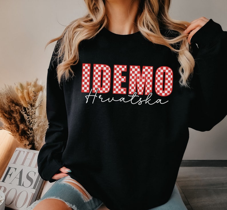 May include: Black sweatshirt with a red and white checkered graphic that says "IDEMO Hrvatska".