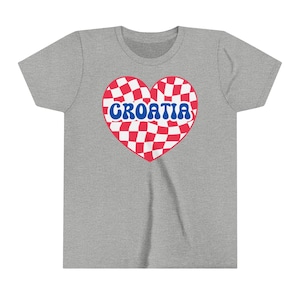 May include: A gray t-shirt with a red and white checkered heart design. The heart has the word "CROATIA" written in blue letters.