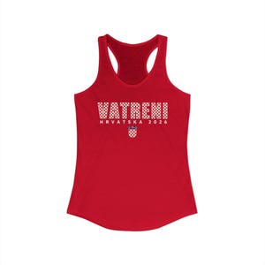 May include: A red racerback tank top with the word "VATRENI" in white, checkered letters. Below the word is "HRVATSKA 2026" and a Croatian coat of arms. The tank top has a scoop neck and a racerback design.