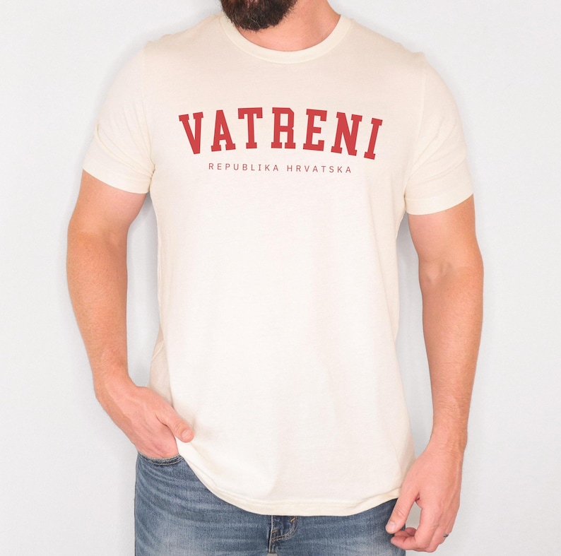 May include: A white t-shirt with a red print that says "VATRENI REPUBLIKA HRVATSKA".