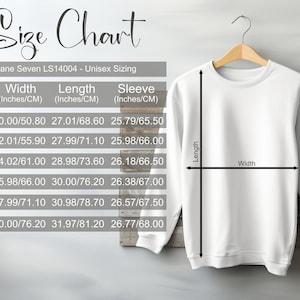 May include: Size chart for a unisex sweatshirt with measurements in inches and centimeters. The chart shows the width, length, and sleeve length for sizes S, M, L, XL, 2XL, and 3XL.