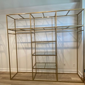 Square clothing display rack with glass shelves