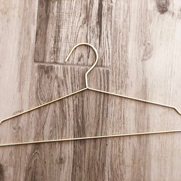 Gold non scratching metal hanger