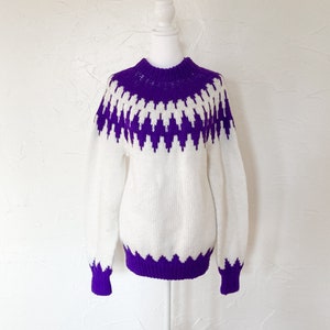 Bright white sweater with fair isle purple knit design, mock neck, pullover style