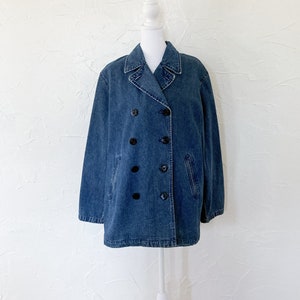 medium blue denim double breasted coat with black buttons that have anchors on them
