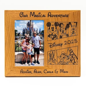 May include: A wooden photo frame with a family photo of four people in front of Cinderella's Castle at Walt Disney World. The frame has an engraved inscription that reads "Our Magical Adventure Disney 2025 Adrian, Alan, Carla & Mom".