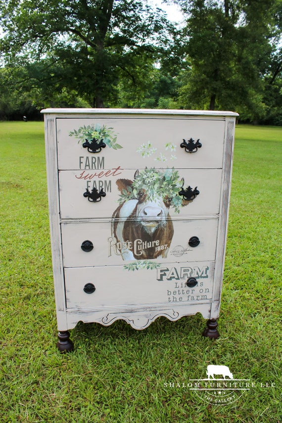 AVAILABLE! shabby chic off-white painted tall boy dresser, adorned with a delightful cow design on the front