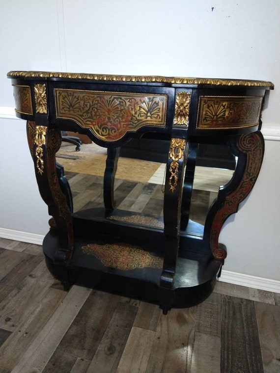 Antique gilt bronze-mounted “Boulle” marquetry inspired and part-ebonised console table