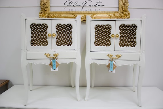 sold!example of my work. pair of French Provincial Victorian Nightstands , Handpainted in a soft white with Vintage Netting Doors