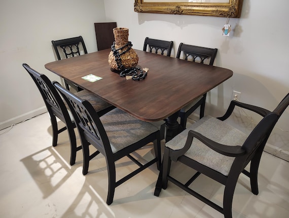 NEW! AVAILABLE! Gorgeous Mid Century Dining room set complete with a dining table with extendable leaf, 6 chairs, matte black and dark wood