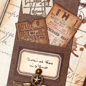 May include: A white ceramic mug with a black handle and the text "But First, Coffee" in a bold, black font. The mug is on a white surface. The mug is approximately 4 inches tall.