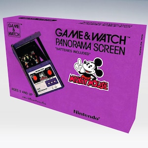 Op de afbeelding: Een paarse doos voor een Game & Watch Panorama Screen met een Mickey Mouse afbeelding. De doos toont de tekst "Game & Watch Panorama Screen" en "Mickey Mouse". De handheld game is zichtbaar. Geschikt voor kinderen vanaf 5 jaar.