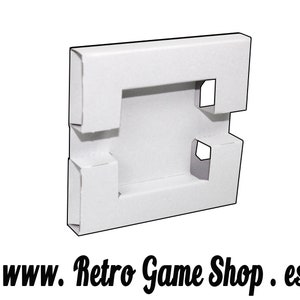 May include: A white cardboard box with a unique cut-out design, likely for packaging. The box has a rectangular shape with several folded edges and openings. The text "www. Retro Game Shop . es" is printed at the bottom.