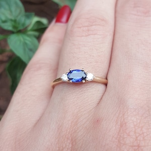 East-West Dainty Oval Blue Sapphire Engagement Ring