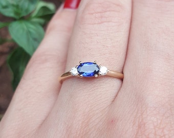 East-West Dainty Oval Blue Sapphire Engagement Ring