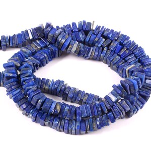 May include: A strand of dark blue lapis lazuli gemstone beads, each bead is a rectangular chip with a slightly irregular shape.