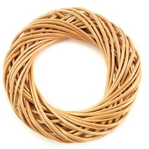 May include: A natural woven wreath made of light brown wicker.