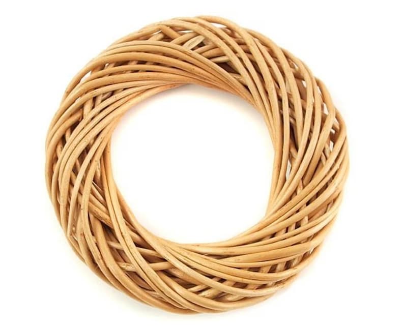 May include: A natural woven wreath made of light brown wicker.