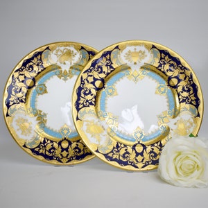 Paar fijne gouden ingelegde dinerborden van De Lamerie, royale patroon.