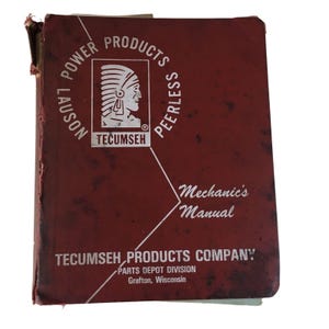 May include: A vintage red Tecumseh Power Products Mechanic's Manual. The cover features white text and a logo of a Native American profile. The manual is from the Tecumseh Products Company, Parts Depot Division, Grafton, Wisconsin.