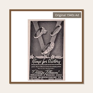May include: A black and white 1940s advertisement for Orange Blossom engagement and wedding rings by Traub Manufacturing Co. The ad features three rings displayed over a large letter V, with the text Rings for Victory and address details.