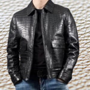 May include: A black leather jacket with a crocodile-embossed pattern. The jacket features a zip fastening, a collared neckline, and two flap pockets.