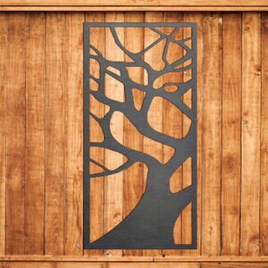 May include: A black metal wall decor featuring a tree branch design with a cutout pattern. The decor is mounted on a wooden wall.